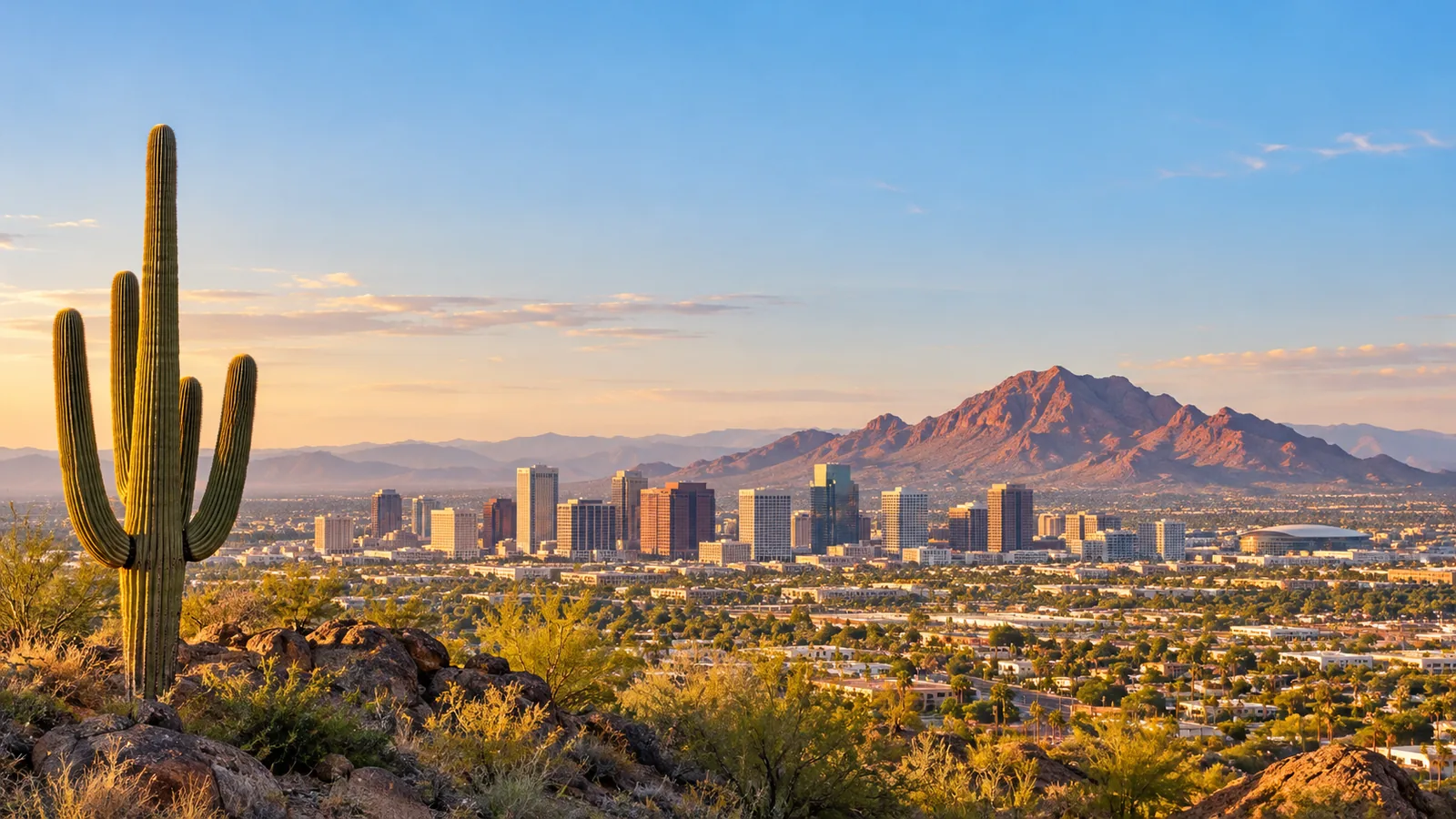 Downtown Phoenix skyline and desert mountains at sunset